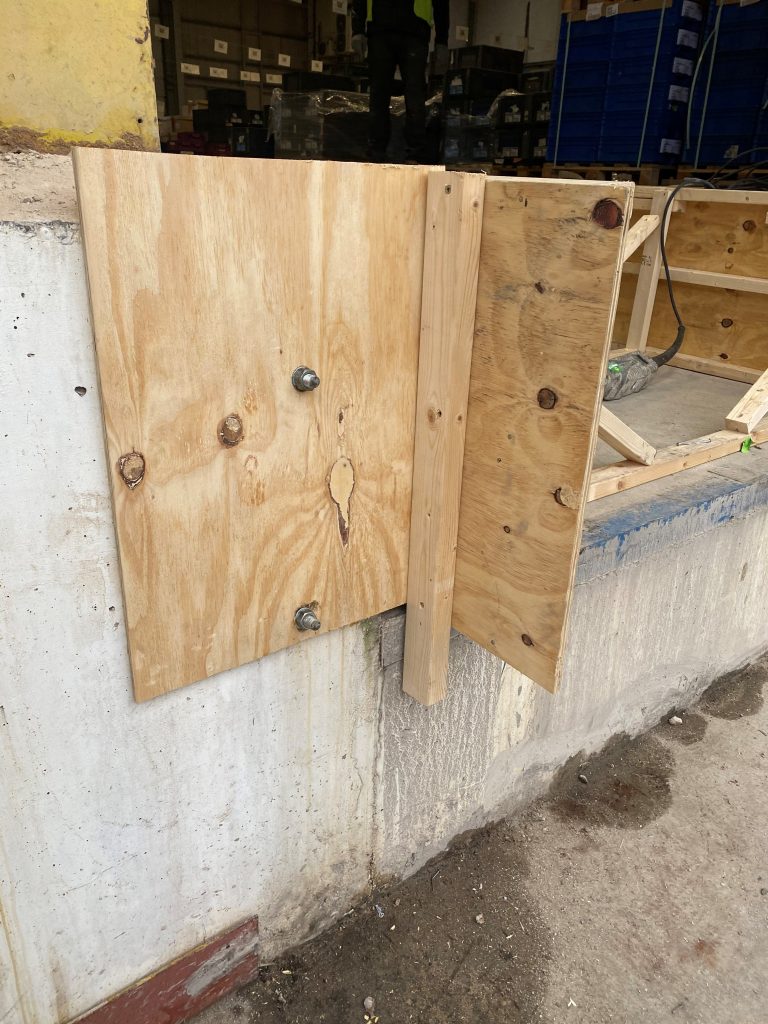 timber shutter on dock leveller pit construction