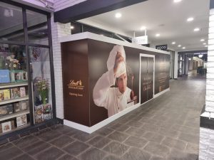 shop front retail hoarding at lindt chocolate uk in cheshire oaks